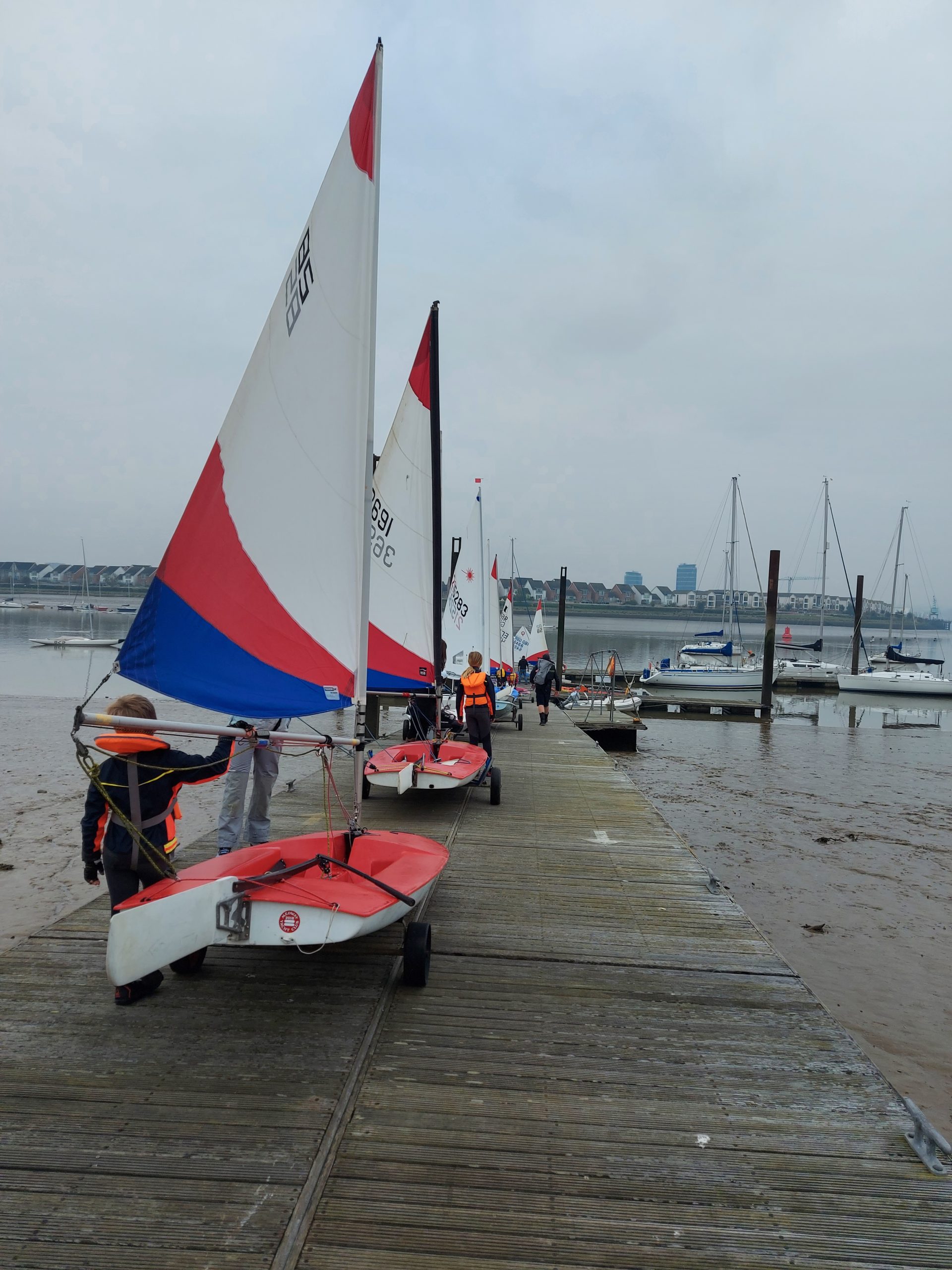 Youth launch procession down pontoon